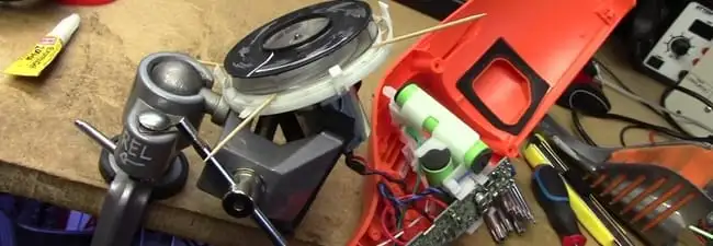 Vacuum cleaner repair parts and tools on a workbench in Aurora, CO